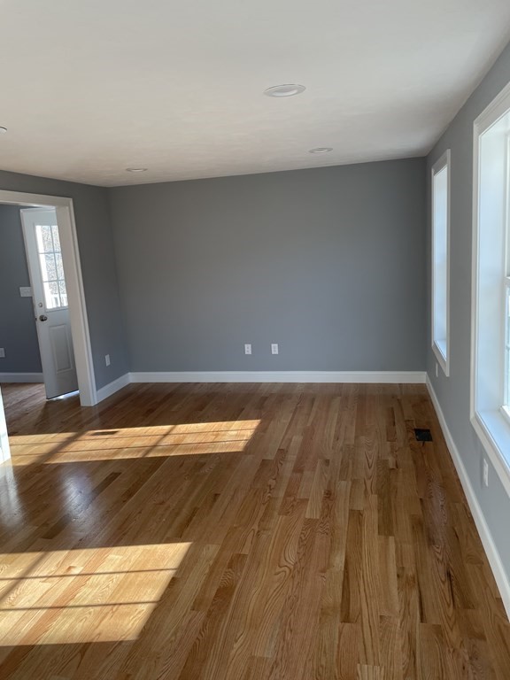 6 Allen Rd Extension Billerica, MA 01821 - Photo 6 of 17 a view of empty room with wooden floor
