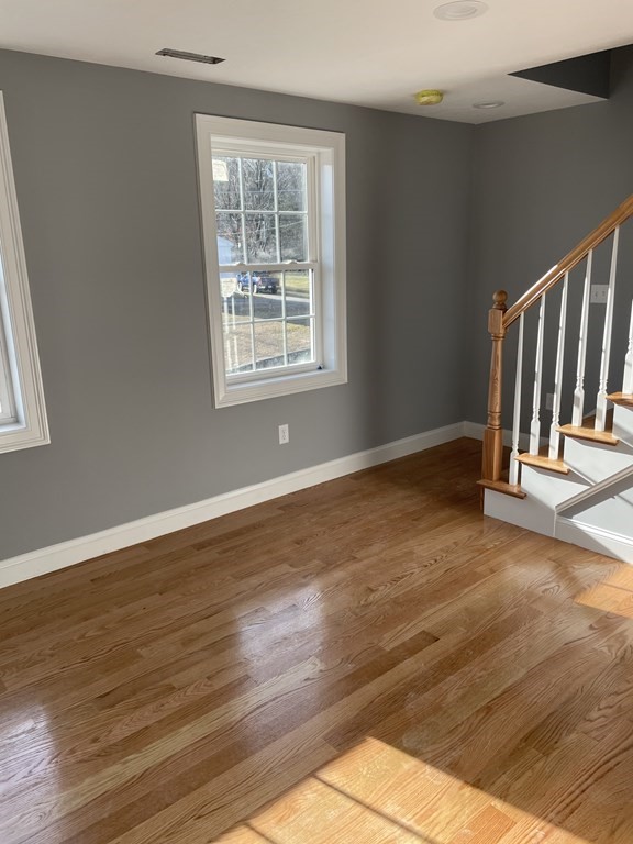 6 Allen Rd Extension Billerica, MA 01821 - Photo 9 of 17 a view of an empty room with wooden floor and a window