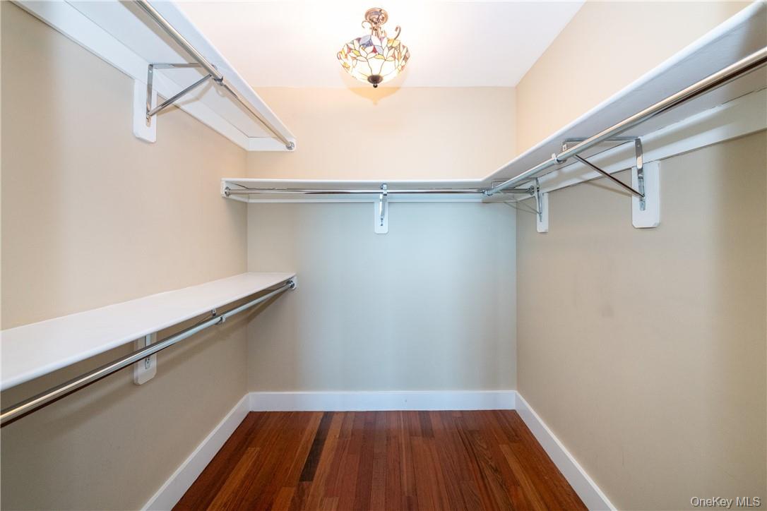 175 Huguenot Street, Unit 1802 New Rochelle, NY 10801 - Photo 18 of 31 a view of a room with racks on the wall