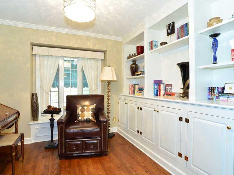 4850 Old Boston Road Whitehall, PA 15227 - Photo 12 of 25 Den. The 12 x 11 den has another fireplace. There is custom built wall to wall cabinetry & shelving, custom draperty treatments, crown molding & gleaming hardwood floors. One can easily work from home...make your business calls today!