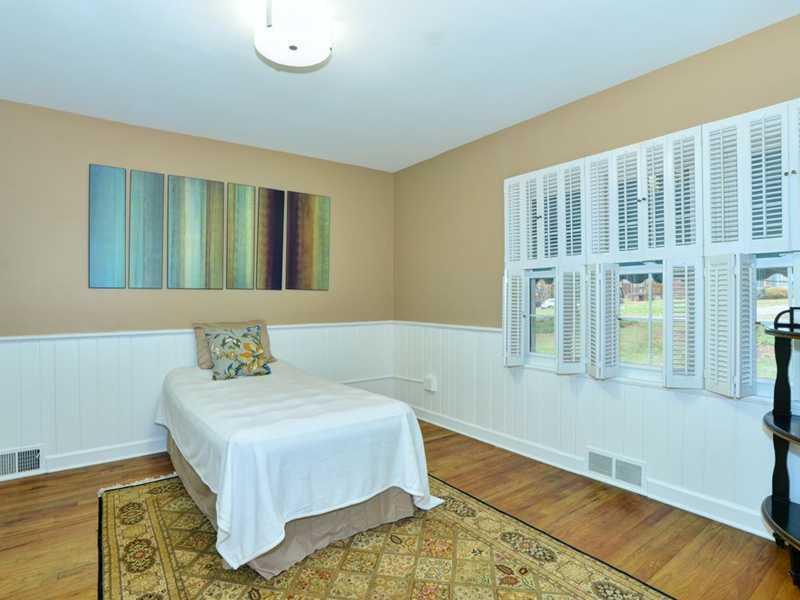 4850 Old Boston Road Whitehall, PA 15227 - Photo 13 of 25 Bedroom. The first floor light & bright bedroom is 12 x 12 & has an adjacent full bathroom. This bedroom can be a mother-in-laws suite or an additional bedroom. There is a roomy closet for one s belongings, along with hardwood flooring, paneling & neutral paint!