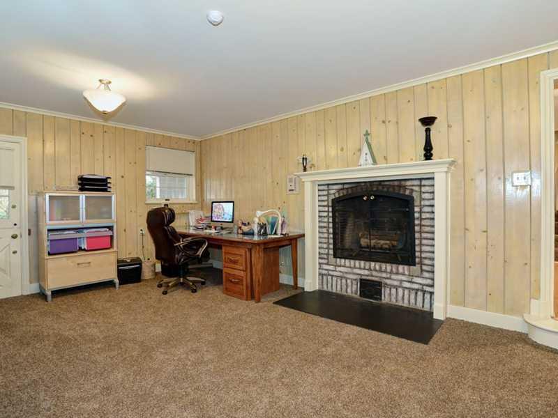 4850 Old Boston Road Whitehall, PA 15227 - Photo 20 of 25 Den/Family/Great Room. The lower level 23 x 15 finished game room has new neutral wall to wall carpeting, custom paneling, log buring fireplace and easy access to the huge brick outdoor patio, private two tiered back yard and pool area.