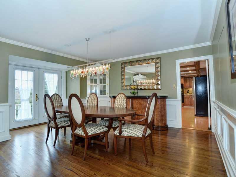4850 Old Boston Road Whitehall, PA 15227 - Photo 6 of 25 Dining Room. The 17 x 14 formal dining room has crown molding, gleaming hardwood floors, wainscoating, chair rail molding and french doors that leads one onto the huge back private deck! This home offers an open floor plan, too!