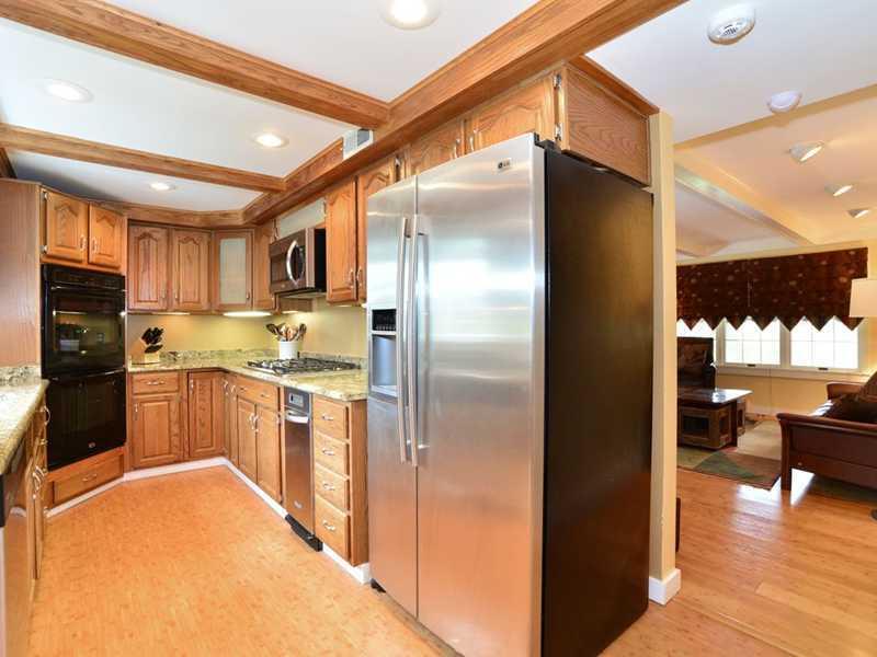 4850 Old Boston Road Whitehall, PA 15227 - Photo 8 of 25 Kitchen. Another view of the custom oak kitchen with a custom oak beamed ceiling & recessed lighting. An easy flow pattern into the family room or into the formal dining room. New double convention oven, gas cook-top, dishwasher, microwave & garbage disposal.