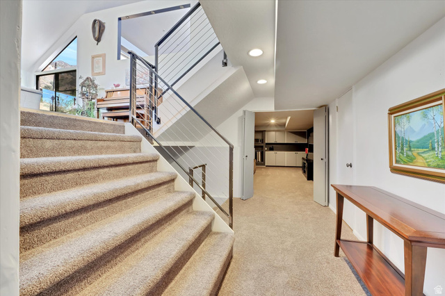 510 Spring Creek Road Providence, UT 84332 - Photo 32 of 97 Carpeted staircase featuring a modern cable railing system and recessed lighting