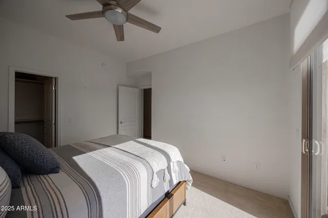 a bedroom with a bed and window