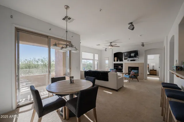 a view of a livingroom with furniture and fireplace