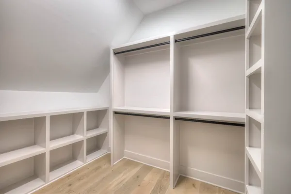 a view of an empty walk in closet