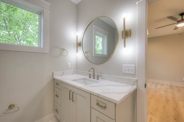 a bathroom with a sink and a mirror
