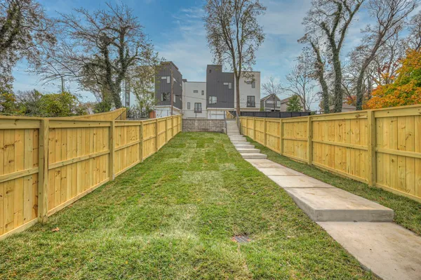 a view of swimming pool with a yard