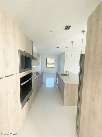 a view of a room with a sink and a vanity