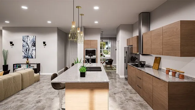 a large kitchen with kitchen island a large counter top space a sink stainless steel appliances and cabinets