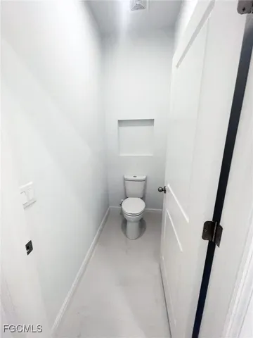 a bathroom with a toilet and a sink