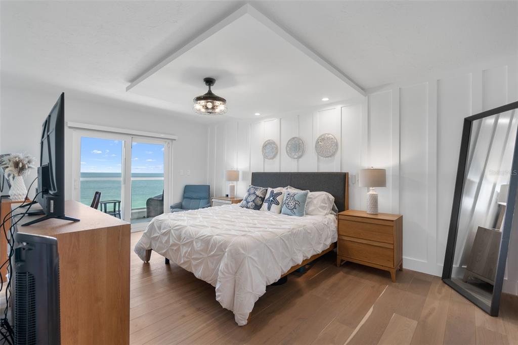 1050 Longboat Club Road, Unit 901 Longboat Key, FL 34228 - Photo 14 of 37 a bedroom with a bed wooden floor and window