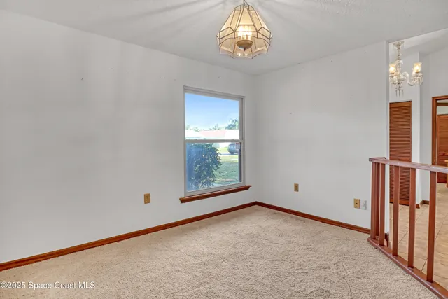 an empty room with a empty space and a window