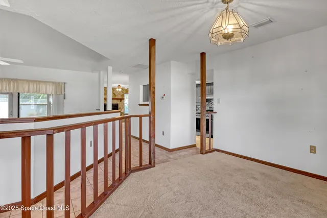 a view of a hallway with windows
