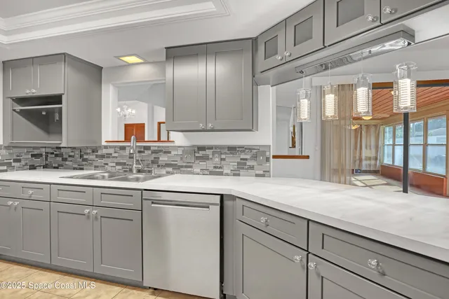 a kitchen with stainless steel appliances granite countertop a refrigerator and a stove