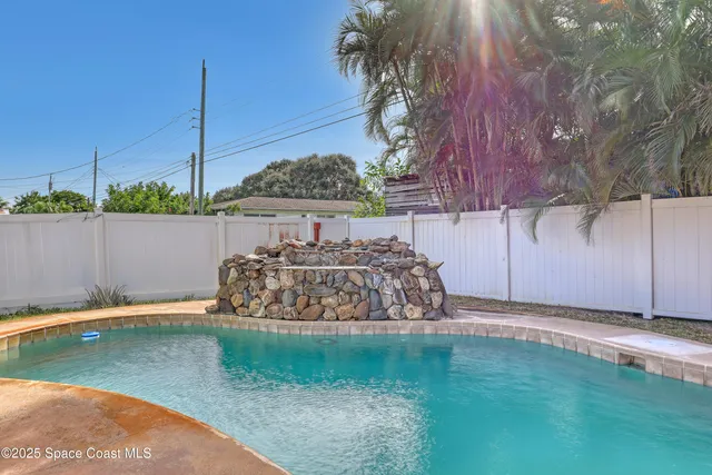a view of a house with swimming pool