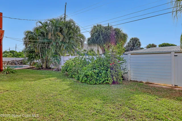 an aerial view of a house with a garden