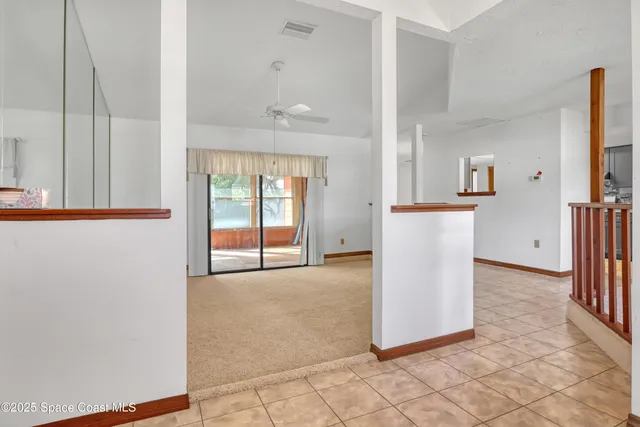 a view of a kitchen with furniture and a window
