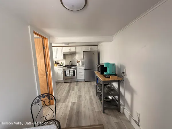 a view of a living room and dining room