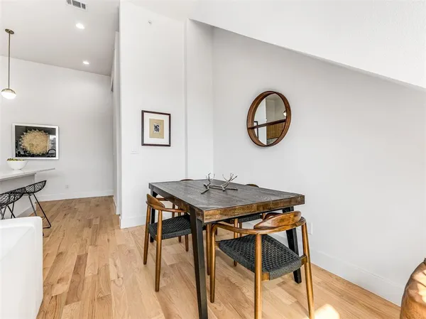 a dining room with a table and chairs