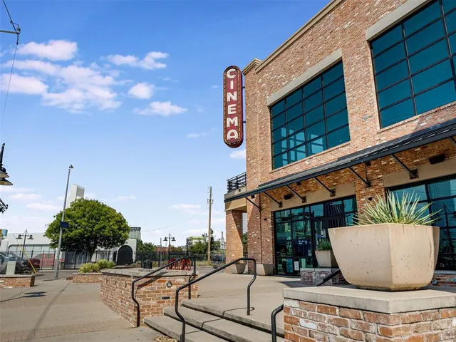 a view of a house with a large tree