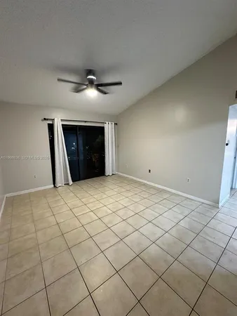 a big room with closet and a chandelier fan