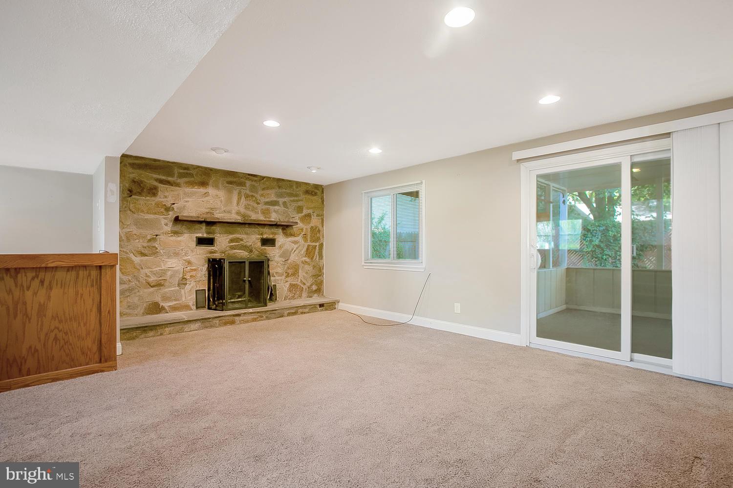 505 Blackstone Road Newark, DE 19713 - Photo 15 of 21 Stone focal wall w/ woodburning fireplace