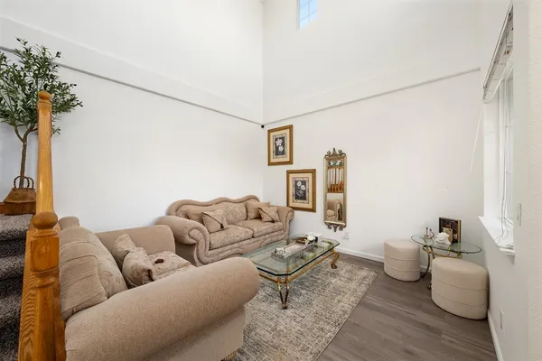 a kitchen with stainless steel appliances granite countertop wooden cabinets sink and a granite counter top
