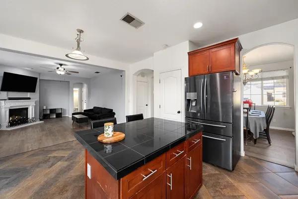 a living room with furniture fireplace and flat screen tv