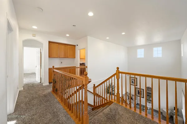 a view of backyard with swimming pool and green space