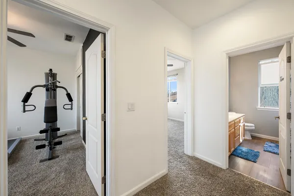 a front view of a house with a yard and outdoor seating