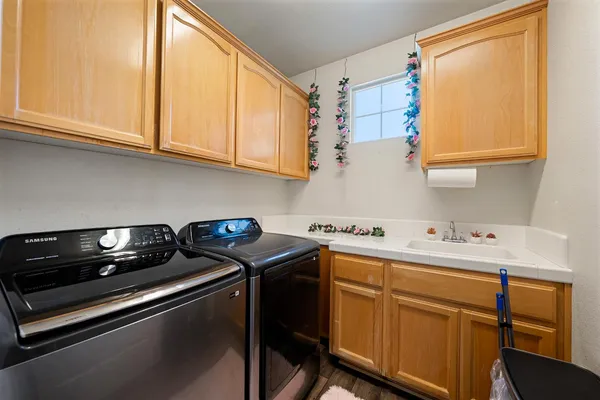a view of an entryway with wooden floor