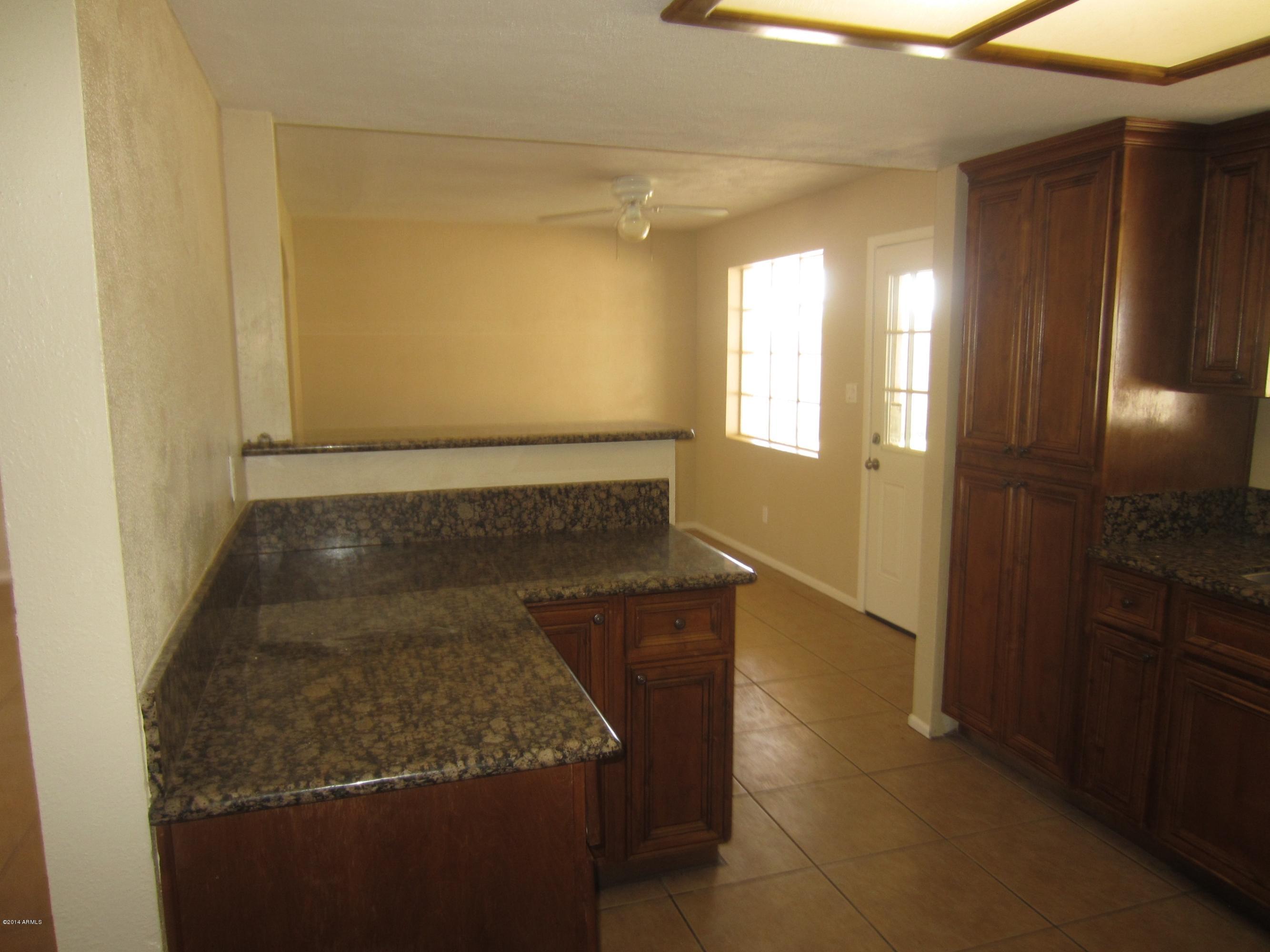 3937 West Griswold Road Phoenix, AZ 85051 - Photo 3 of 10 KITCHEN TO DINING