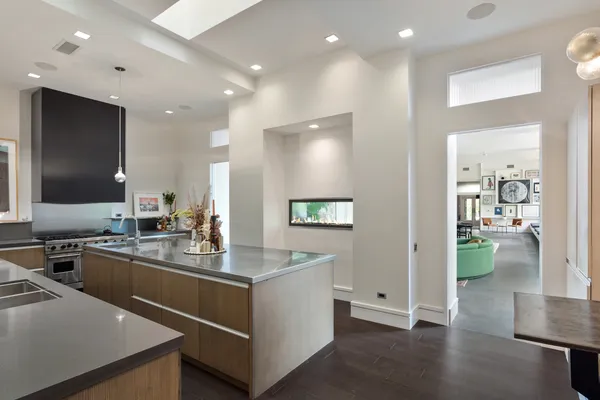a kitchen with a sink stove and cabinets