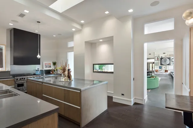 a kitchen with a sink stove and cabinets