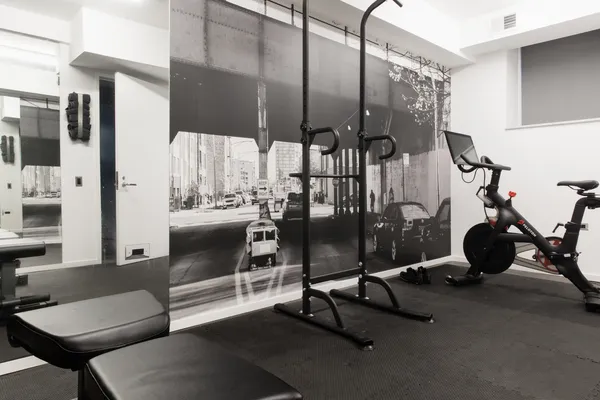 a view of a patio with chairs and potted plants