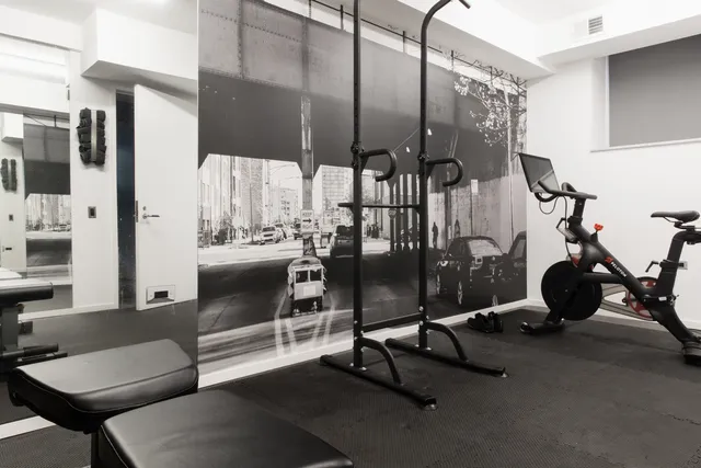 a view of a patio with chairs and potted plants