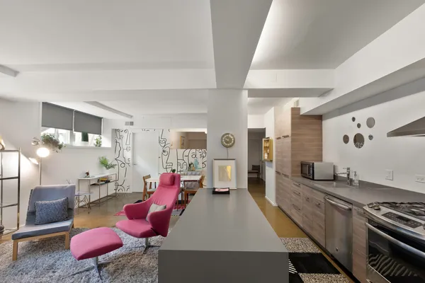 a view of a patio with couches and potted plants