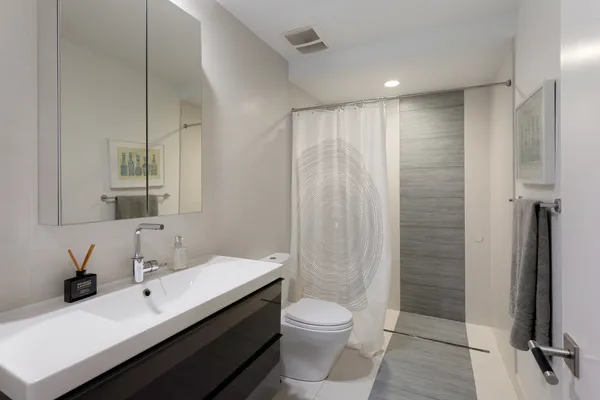 a view of a patio with chairs and potted plants