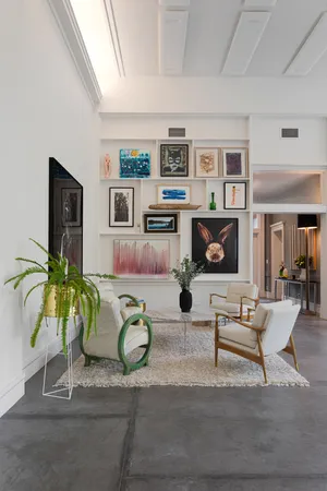 a living room with furniture and a table