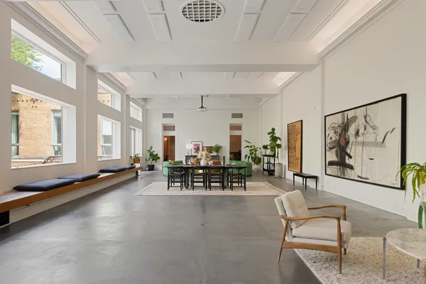 a room with lots of furniture and window