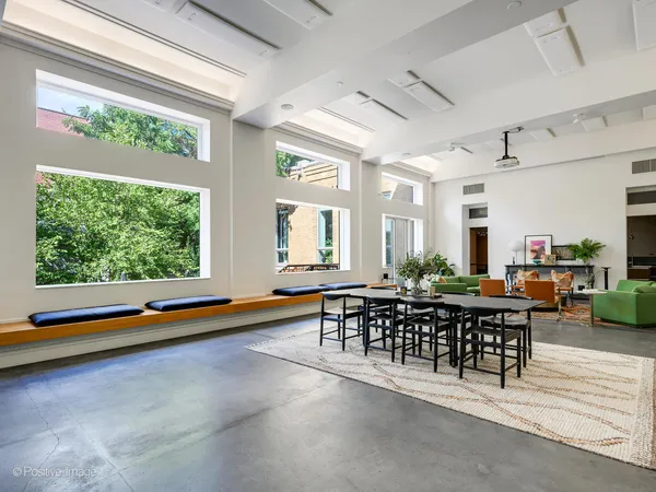 a view of room with furniture and wooden floor