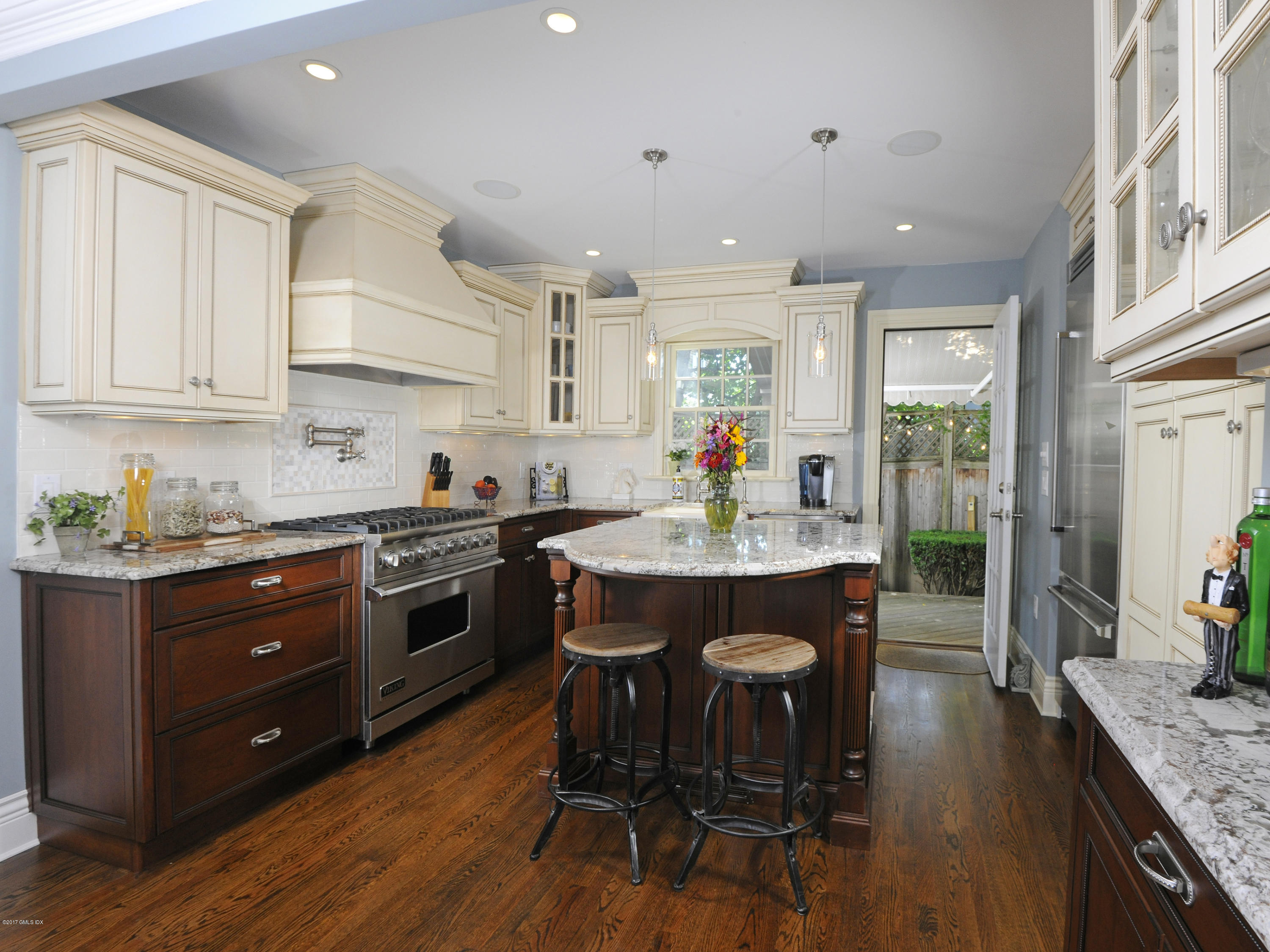 4 Sunshine Avenue Riverside, CT 06878 - Photo 11 of 21 a kitchen with stainless steel appliances granite countertop wooden floors stove refrigerator and dining table