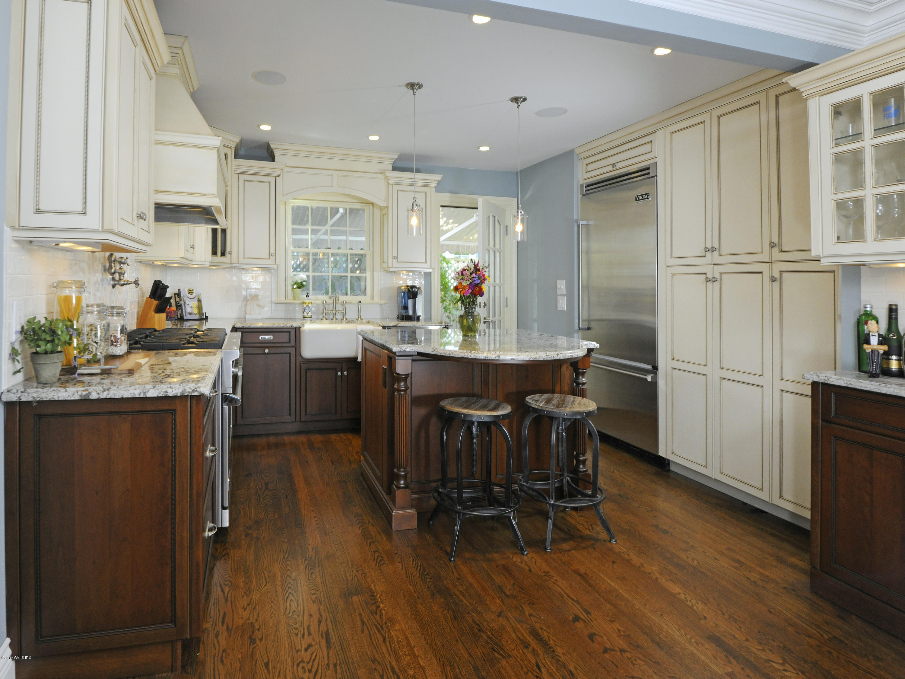 4 Sunshine Avenue Riverside, CT 06878 - Photo 12 of 21 a kitchen with stainless steel appliances granite countertop a dining table chairs refrigerator and sink