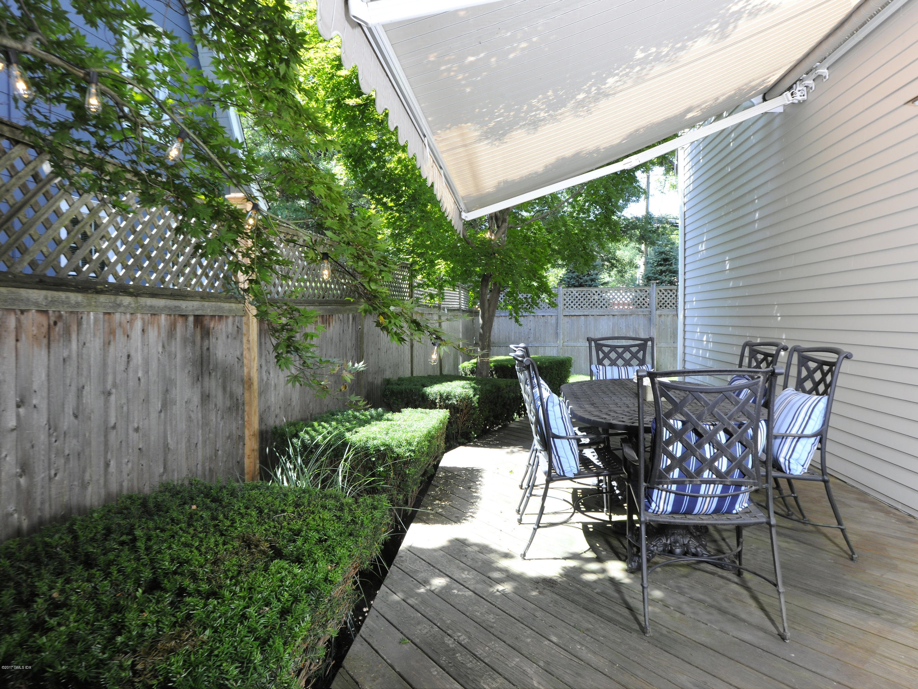 4 Sunshine Avenue Riverside, CT 06878 - Photo 20 of 21 a view of a chairs and table in patio with wooden fence