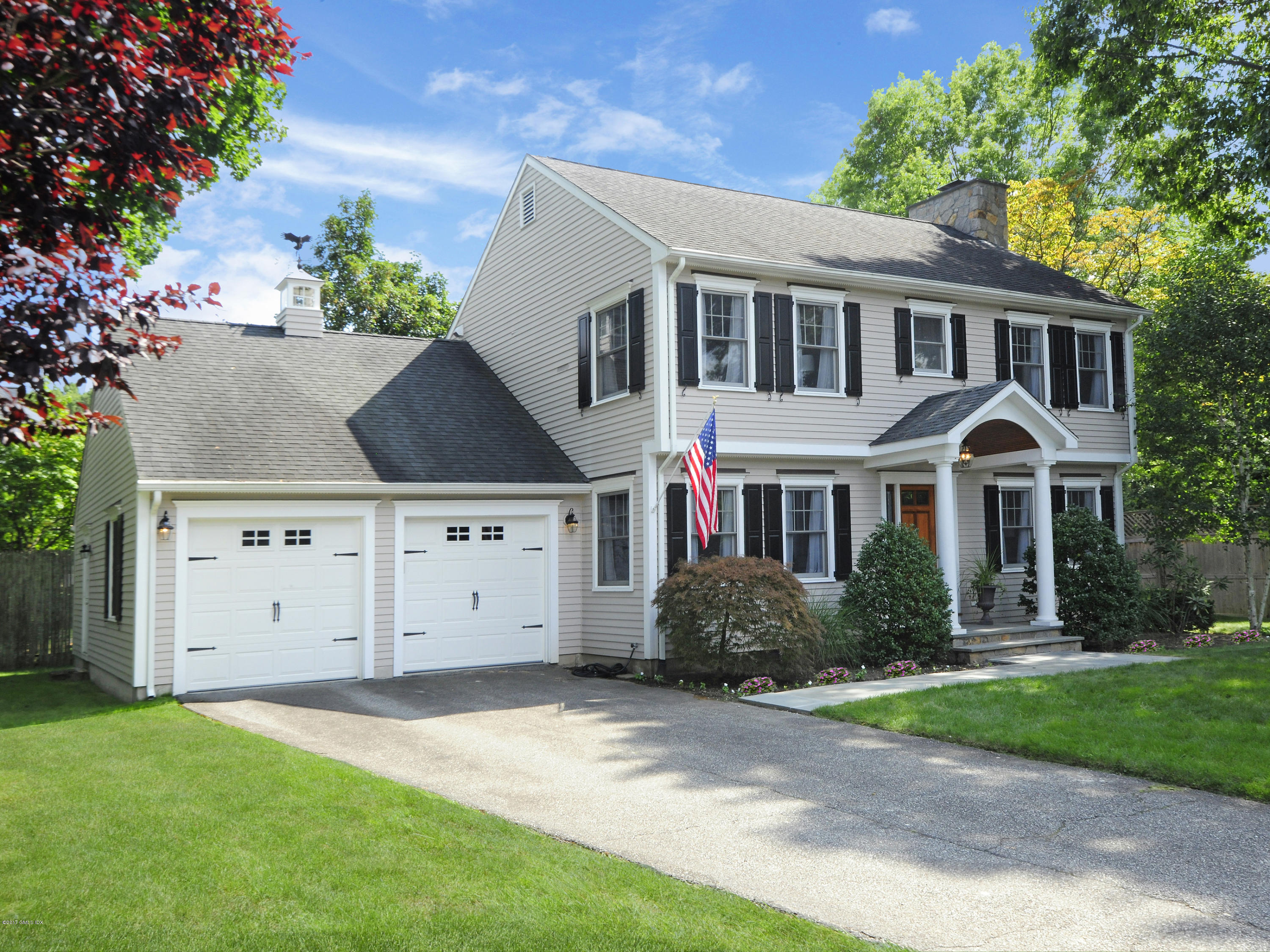 4 Sunshine Avenue Riverside, CT 06878 - Photo 2 of 21 a front view of a house with a yard and garage
