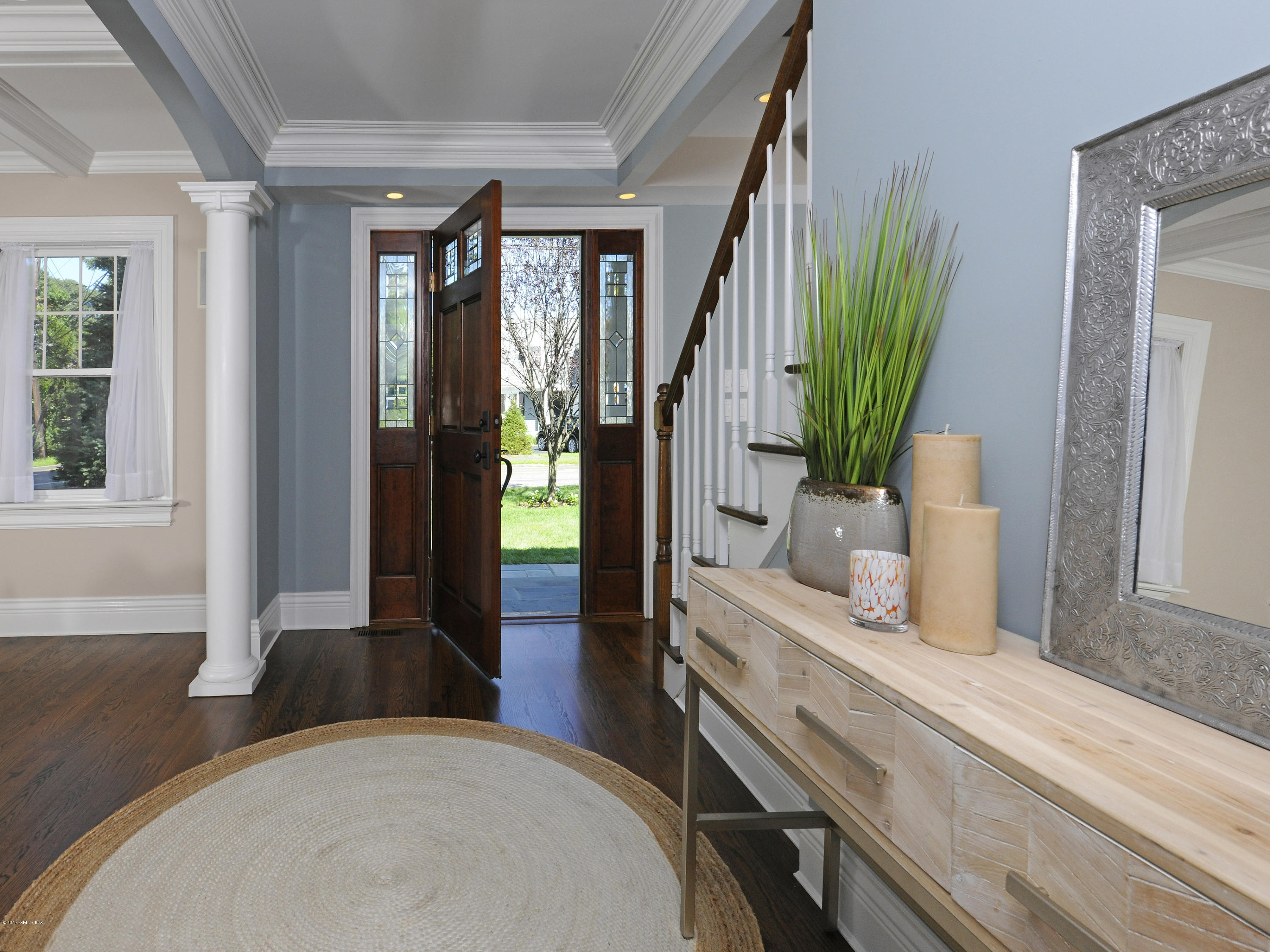 4 Sunshine Avenue Riverside, CT 06878 - Photo 5 of 21 a bedroom with a bed and large windows