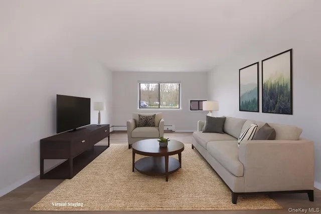 a view of an empty room and wooden floor